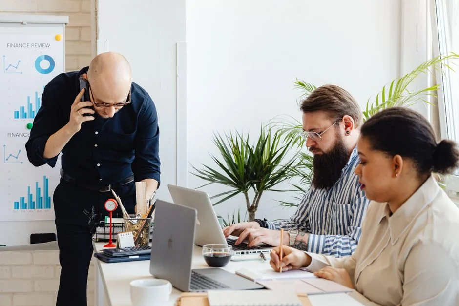 Man analyzing marketing content strategies using sticky notes on a whiteboard.